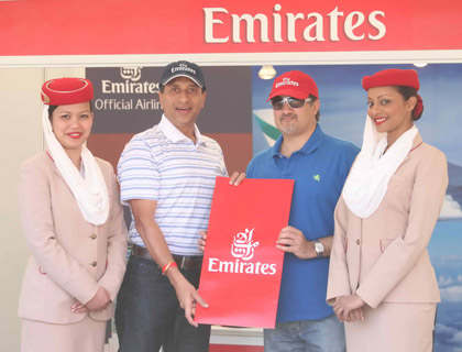 Vinay Malhotra presenting the Spot the Cap winner with a pair of return tickets to either Dallas or Seattle