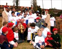 Francois Piennar shares his experience and the Webb Ellis Cup with children from St. Johns School and their sister school in Soweto. Also pictured are Emirates Cabin Crew Jacqueline Botha and Elizabeth Van Rooyen