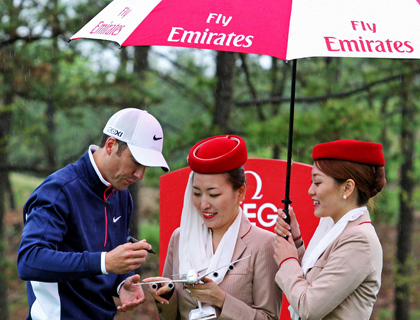 Ross Fisher signing an Emirates A380 aircraft during the Ballantine's Championship pro am