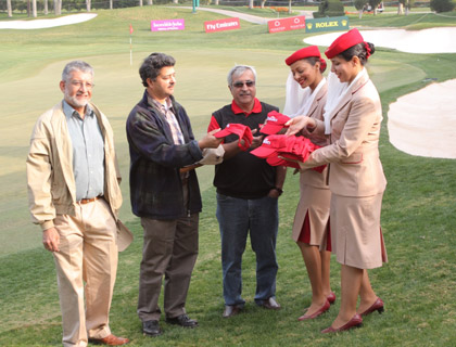 Emirates cabin crew distributing Emirates caps to visitors for the Spot the Cap competition